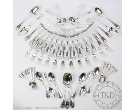 A Victorian part suite of fiddle, shell and thread silver flatware, comprising eighteen table spoons, twelve dessert spoons, 