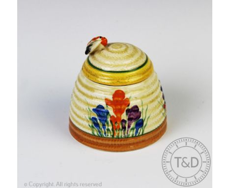 A Clarice Cliff crocus pattern honey pot and cover, the lid at fault, 10cm high CONDITION REPORT: Base - Green lined rim very