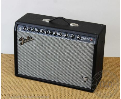 A Fender Deluxe amp, type PR772, Number B-409628, with pedal board. This lot is sold as decorative item only, prospective buy