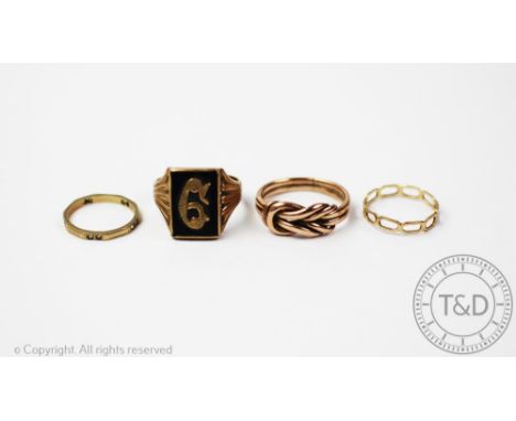 A 9ct gold entwined knot ring, along with a signet ring stamped '9ct gold', and two further rings stamped '9ct', gross weight