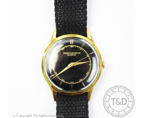 A Baume &amp; Mercier gold plated watch 1962, the circular black dial with gilt batons, hands and centre sweep seconds, case 