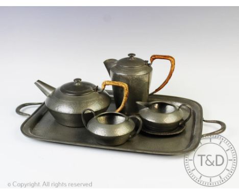 A Tudric Pewter Ware tea service circa 1950, each piece with lightly planished detail and reeded handles, numbered 01537, com