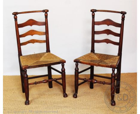 A harlequin set of six 19th century 'Macclesfield' dining chairs, with carved bobbin cresting rails and ladder back, with rus