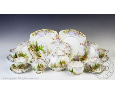 A Royal Albert Kentish Rockery pattern tea service, comprising; twelve teacups and saucers, twelve cake plates, two serving p