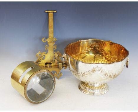 A plated punch bowl, with a brass mounted optical lens and bracket (3)