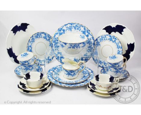 A Coalport batwing part tea service, comprising; eight tea cups, eight saucers, six side plates two serving plates a milk jug