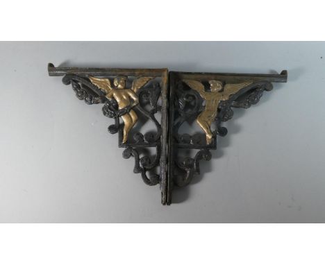 A Pair of Cast Metal Shelf Brackets Decorated with Angels, 27cm high 