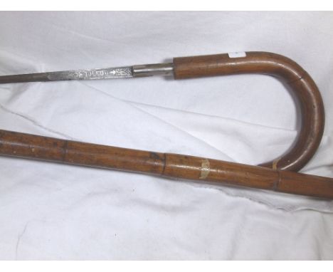 ANTIQUE BENTWOOD SWORD STICK. Antique malacca cane sword stick with Toledo steel blade L: 27 cm, overall L: 90 cm