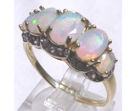 AUSTRALIAN OPAL RING. 9 K gold ring set with Australian Welo opals and diamonds, size S/T