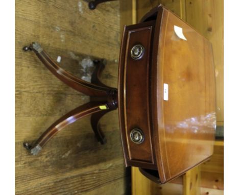 A Georgian-style mahogany smaller sized sofa table with string inlay to the top, twin drop leaves, one drawer under with circ