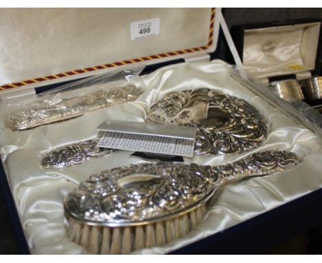 A cased modern silver brush and mirror set