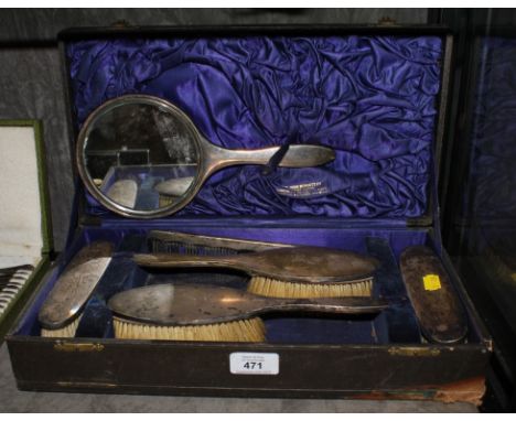 A cased lady's silver brush and mirror set