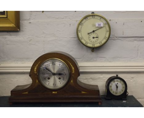 An Edwardian mahogany cased dome topped mantle clock with cross banding and mother of pearl inlay to the front, circular dial