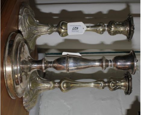 A pair of 19th century French-style silver plated candlestick holders of baluster form with acanthus leaves decoration and on