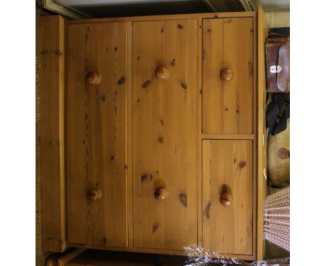 A pine chest of two small and two long drawers with shaped top, circular handles on plinth, 88H x 93W x 44cmD