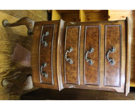 A Georgian-style mahogany and walnut bow fronted smaller chest of drawers or bedside locker with shaped top, four drawers und