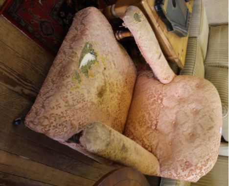 A Victorian mahogany-framed low armchair with button back fabric upholstered support, arms and seat on ring turned legs with 