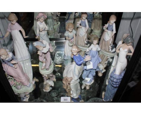 An assortment of eleven Nao figurines of young girls and boys