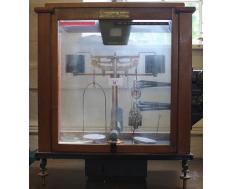 A Releas-o-matic scales in glass mahogany-framed case by L. Oertling Limited, London (patent number 720 271; serial number 43