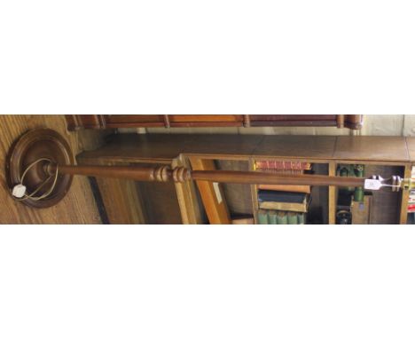 A mid 20th century hardwood stained floor lamp with a turned central column on a circular base, 142cm high