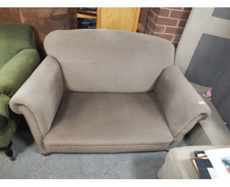 AN ANTIQUE DROP ARM UPHOLSTERED SOFA