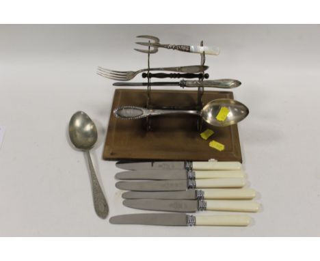 A SMALL BOX OF FLATWARE TO INCLUDE HALLMARKED SILVER AND CONTINENTAL EXAMPLES STAMPED 800.  together with a brass display sta