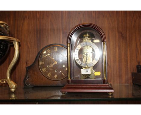 A MODERN REPRODUCTION MAHOGANY SKELETON MANTEL CLOCK together with a vintage oak example (2)