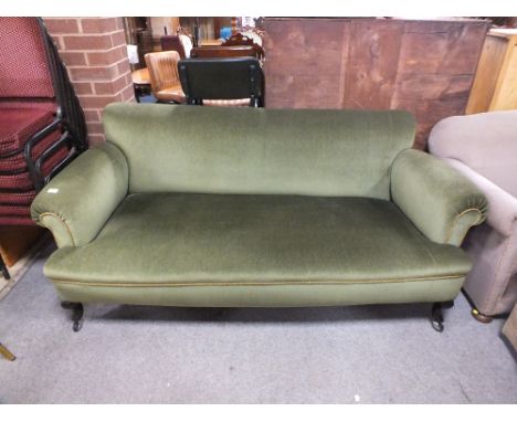 AN EARLY 20TH CENTURY UPHOLSTERED SCROLL ARM SOFA