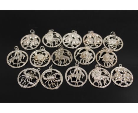 A BAG OF STERLING SILVER SIGNS OF THE ZODIAC PENDANTS 