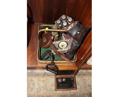 A BASKET OF ASSORTED COLLECTABLES to include a leather four bottle carrier a/f, carved treen, mantel clock etc. 