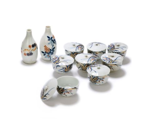 Saki bottles: H:5 1/4in(13.3cm) X 2.5in(6.3cm) Cups: 2.5in(6.3cm) X 3 1/4in(8.2cm)