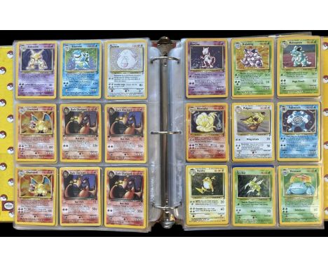 Pokemon TCG trading cards. A folder containing Base Set 2, Team Rocket, Jungle, Fossil, and Japanese cards. Two Base Set 2 4/