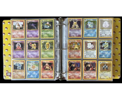 Pokemon TCG trading cards. A folder containing cards from Base, Fossil, Gym Heroes, and Team Rocket sets together with Japane