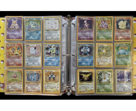 Pokemon TCG trading cards. A folder containing complete/near complete sets of cards; two base sets, two jungle, two fossil, a