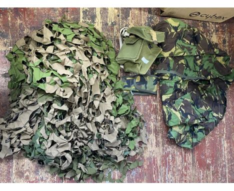 A selection of assorted military items including a WW2 light MKII webbing pooch dated for 1944 and a camo net 