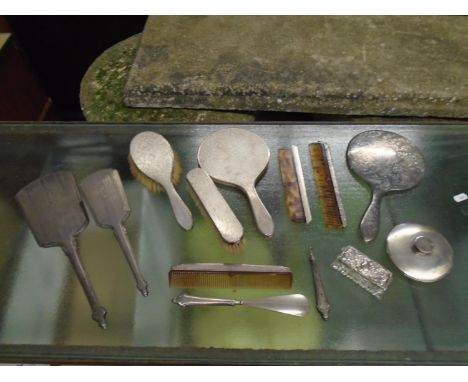 A group of early 20th century silver backed dressing table items to include a four-piece brush, mirror and comb set with mach