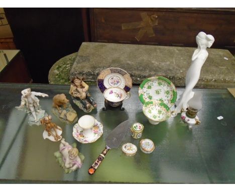 A selection of ornaments to include two 19th century cups and saucers, a Crown Derby handled cake slice, Naples Capodimonte f