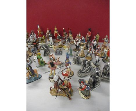 A large quantity of painted figures of soldiers and models of mystical figures to include a Chas Stadd model of a fireman res