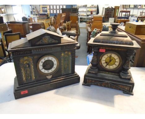 A Victorian black slate architectural style mantel clock with gilt brass inset plaques depicting Roman soldiers within recess