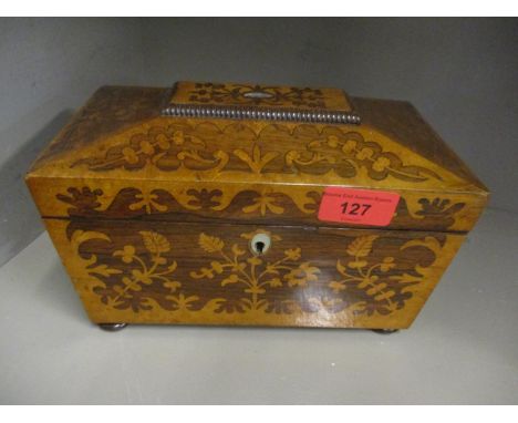 A Victorian rosewood marquetry sarcophagus formed tea caddy on bun feetCondition: missing an oval piece from the lidLocation: