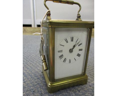 A brass cased and enamelled twin dial, five window carriage clock with key A/F, 4 1/2cm highCondition: various cracks to one 