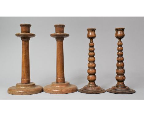 Two Pairs of Wooden Candlesticks Including Tapering Bobbin Examples by Rayswi of Harrogate, 24cm and 27cm high 