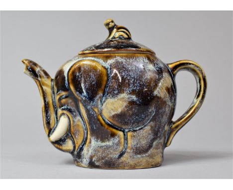 A Glazed Novelty Teapot In the form of an Elephant with Monkey Finial, 12cm high 