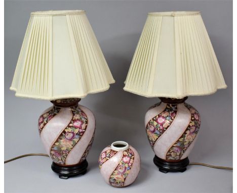 A Pair of Rose Decorated Ceramic Table Lamps and a Matching Ginger Jar 