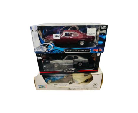 3 BOXED LARGER SCALE MODEL CARS 