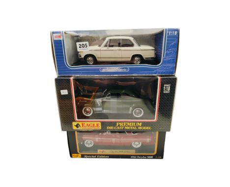 3 BOXED LARGER SCALE MODEL CARS 