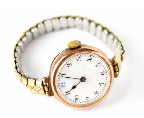 A ladies' vintage hallmarked 9ct gold watch, the white dial set with numbered increments on a gold plated flexi strap, approx