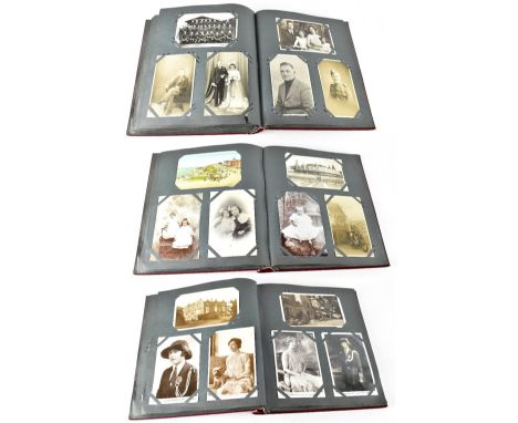An album of vintage postcards comprising buildings, Royalty, places, birthday cards and a mix of old family photographs inclu