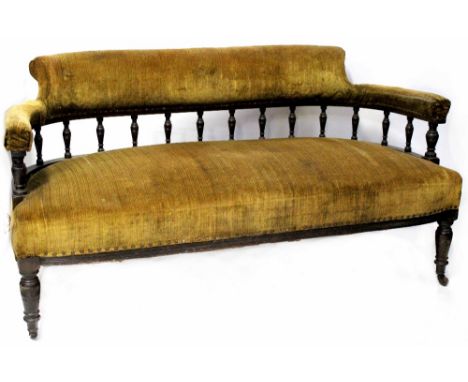 A 19th century two-seater settee with mustard-green velour upholstered backs, arms and seats, bobbin turned open back rail ra