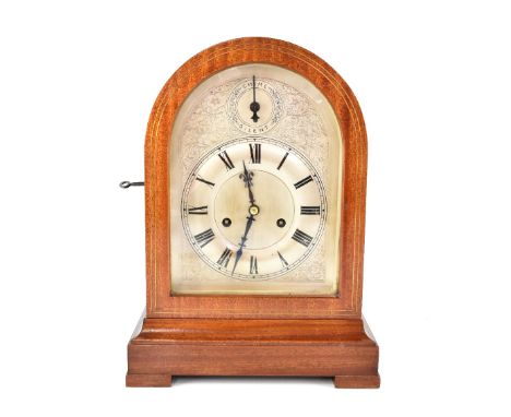 A mahogany and brass line inlaid Westminster chiming dome-topped bracket clock, with silvered dial and chapter ring bearing R